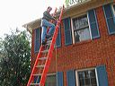 Brian hanging the Christmas Lights